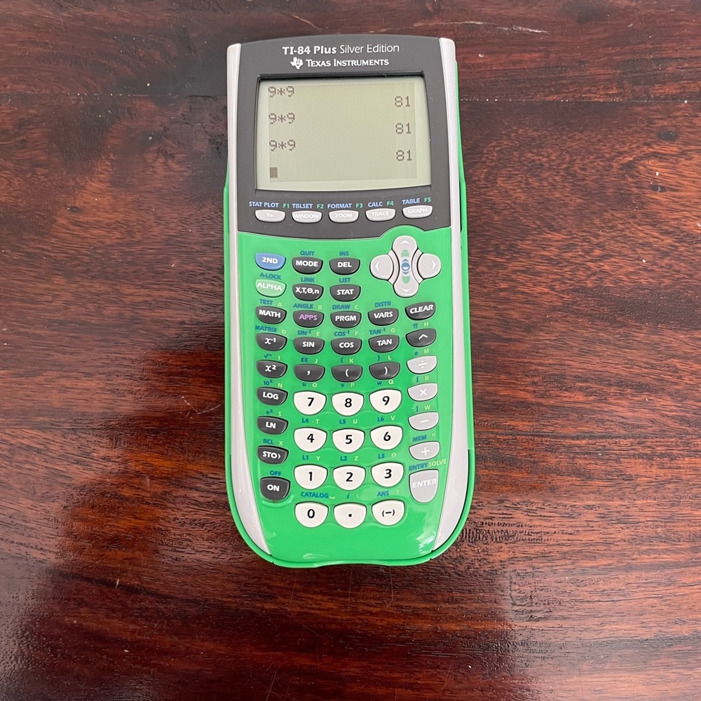 Graphing calculator TI-84 plus green with batteries